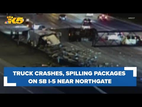 All lanes on SB I-5 near Northgate closed due to semi-truck crash, packages spilled on roadway