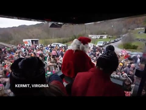 Santa's annual train visit delivers toys to towns along rail network