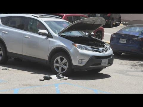 Hidden tracking device, packages taped under woman's car