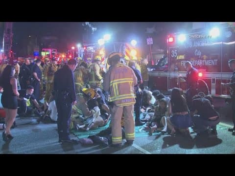 Man whose car struck crowd outside Los Angeles club, injuring 30, was shot, attacked by crowd