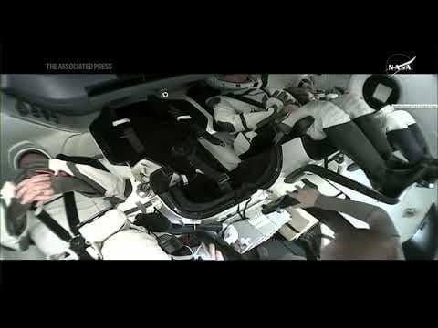 Stranded astronauts board SpaceX capsule for return to Earth