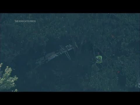 Skydiving plane goes off New Jersey runway and crashes into woods, sending 15 to hospital