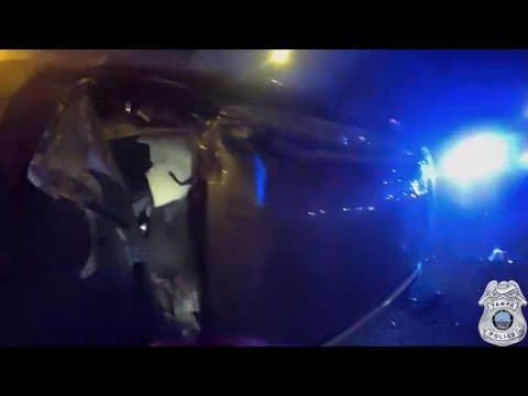 WATCH: Tampa police rescue woman from car flipped over, on fire