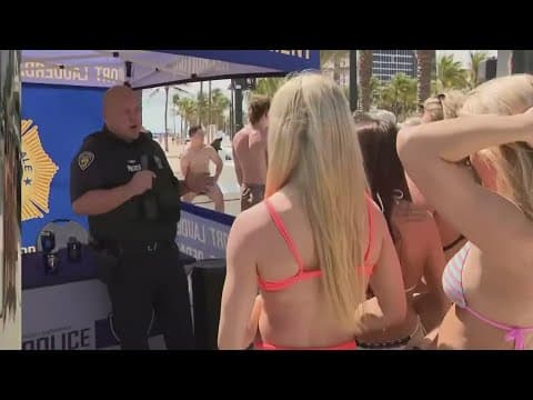 Police department recruiting on the beach during spring break