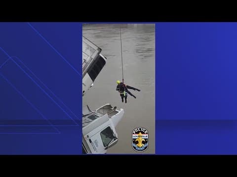 Kentucky firefighters rescue driver from dangling truck