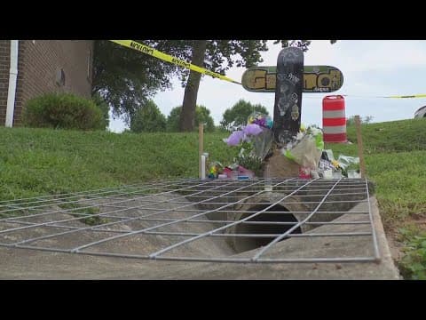 Temporary grate installed over storm drain where child drowned during flash flooding