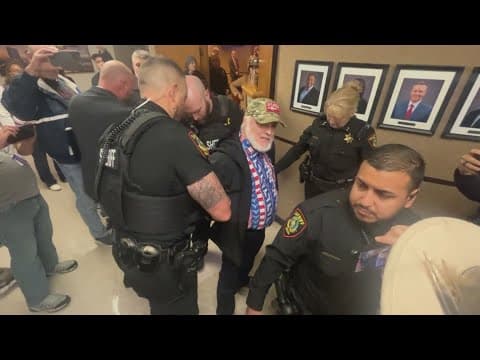 Three detained at Tarrant County Commissioner's Court during briefing on jail deaths