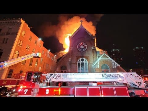 Workers prepare for emergency demolition after fire at historic Indianapolis building