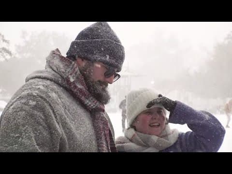 Families, friends and pets enjoy snow in Hammond, Louisiana