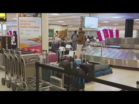 Airlines scramble to recover from Christmas storms across the country