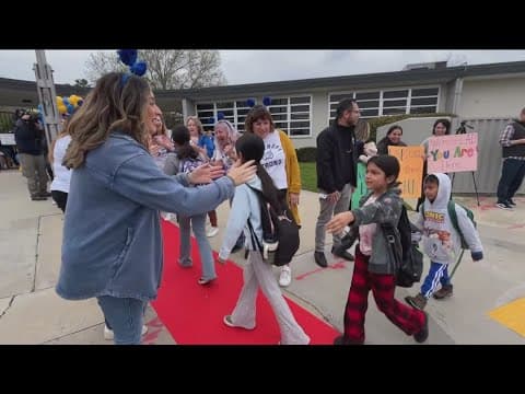 Cheering greets students returning to Bancroft Elementary in Spring Valley a month after the flood