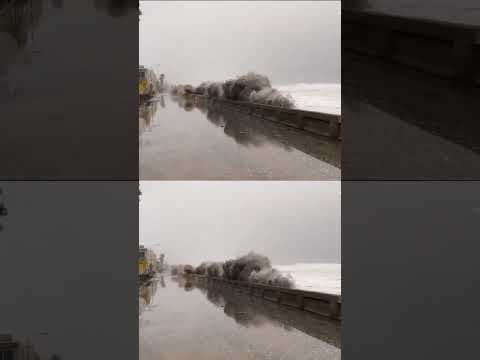 Giant waves washed over the beach wall and onto the Mission Beach Boardwalk on Tuesday, Feb. 20.