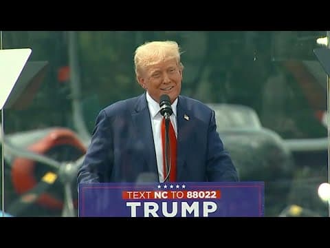 Donald Trump holds first outdoor rally since assassination attempt surrounded by bulletproof glass