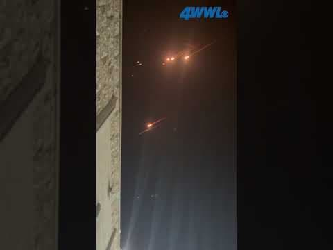 Woman shares a video that appears to show fiery projectiles streaking over the Palestinian town