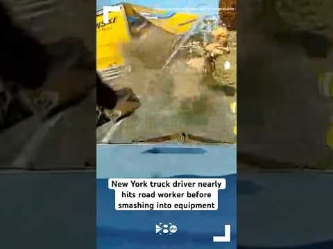 New York truck driver nearly hits road worker before smashing into equipment