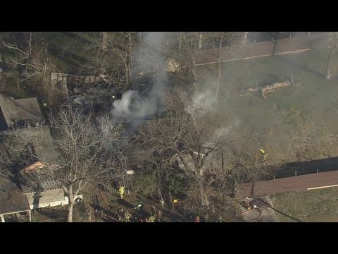 Firefighters battle fire at NE Houston home