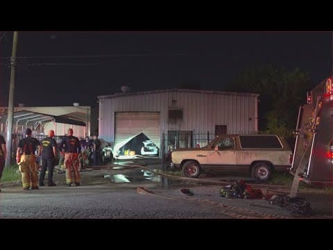 Firefighter taken to hospital for heat exhaustion while battling fire at auto shop