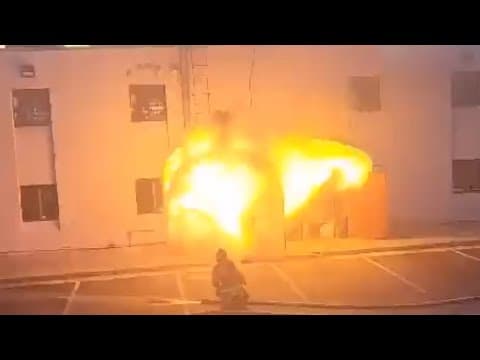 Fiery explosion erupts after firefighter opens door