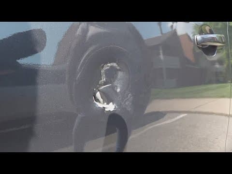 Indianapolis woman says 2 men threw racial slurs at her and her kids, put hole in her car door