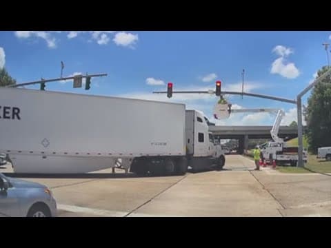 Dash cam: Utility worker bucket struck by semi