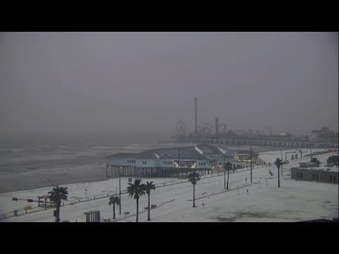 Rare snowfall coats the beach in Galveston