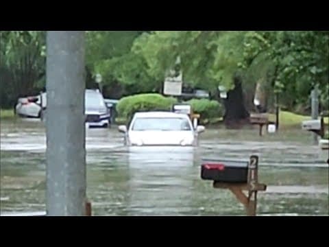 Driver tries to get through high water along Humble street
