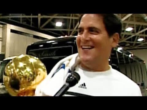 Mark Cuban shows off the Larry O'Brien Championship Trophy (June 16, 2011)