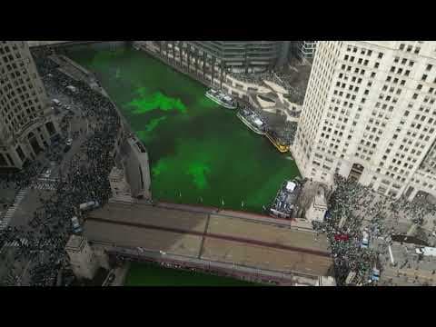 Aerial footage captures bright green Chicago River as people celebrate St. Patrick's Day