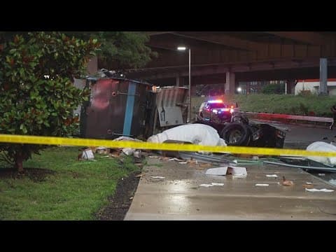 Downtown Dallas crash causes big rig to dangle over bridge
