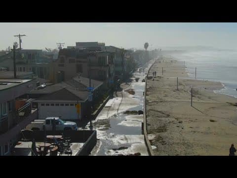 Rushing waves flood coastal areas of San Diego County after a powerful storm drenched California