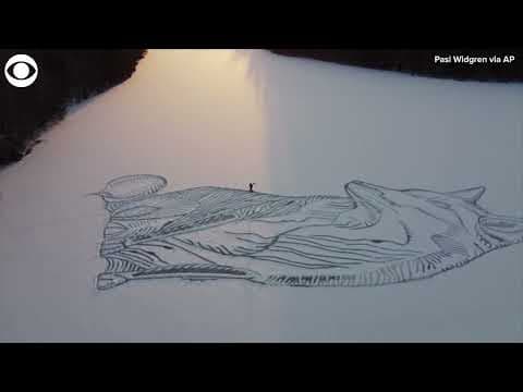 Architect draws giant fox on frozen lake