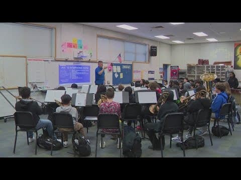 Commanders' trumpet player doubles as the Holmes Middle School band director