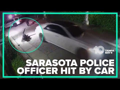 Sarasota police officer hit head-on by car, video shows