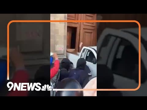 Protesting students use truck to ram down doors of Mexico City's National Palace
