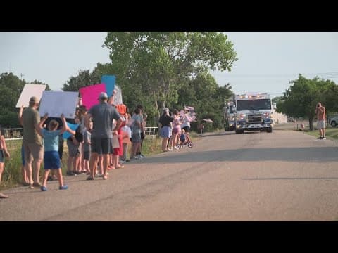 Firefighter makes triumphant return home after being injured in a house fire