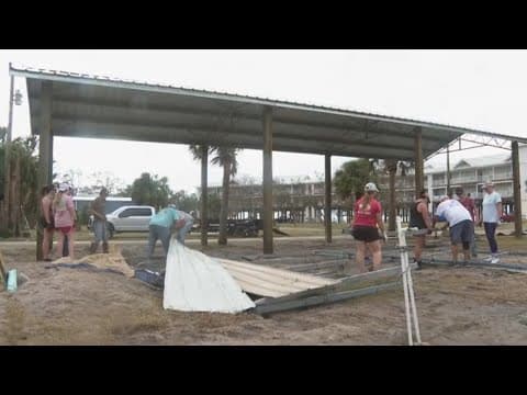 Florida residents begin to clear up debris and damage left by Hurricane Helene