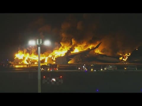 Plane catches fire on runway at Japan's Haneda airport after collision, passengers reportedly safe