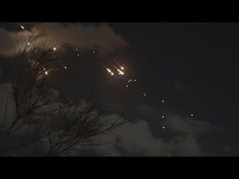 Iran fires dozens of missiles into Israel in a sharp escalation of regional conflict