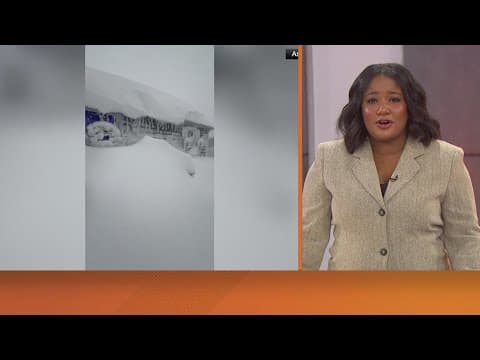 Heavy snow falls in the Great Lakes region as travelers attempt to head home