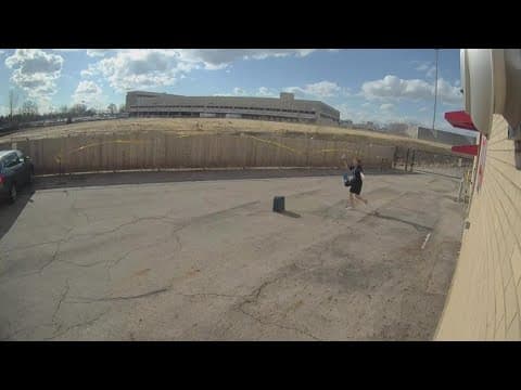 Wind blows away Yolanda Harris' suitcase