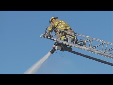 Harvey fire destroys home, threatens nearby buildings