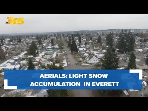 Drone footage of snow on Everett rooftops