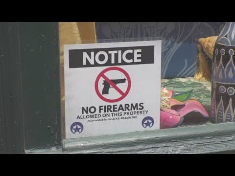 Businesses add 'No guns' signs as law changes