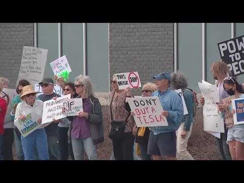 Hundreds gather to protest at Tesla dealership at Easton Town Center