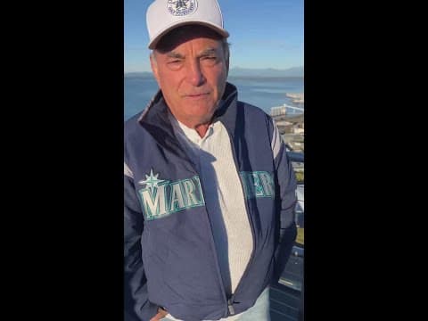 Rick Rizzs raising the Mariners flag