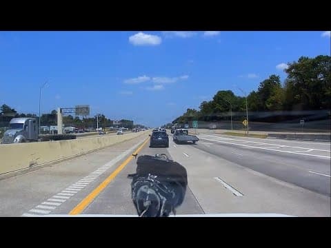 Dashcam video: Piece of engine crashes through woman's windshield