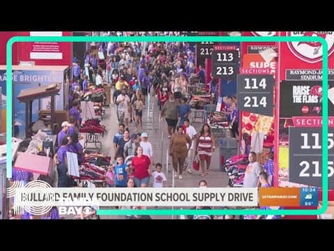 Volunteers prep 30,000 backpacks to give away for free