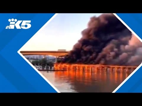 Crews battling large fire on old railway trestle outside of Vancouver BC