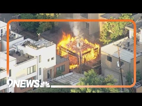Huge flames as crews extinguish garage fire in Denver