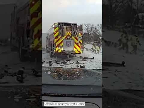 Truck crashes into emergency vehicles in Michigan #shorts